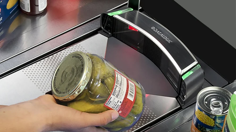 POS terminal reads a barcode on groceries.