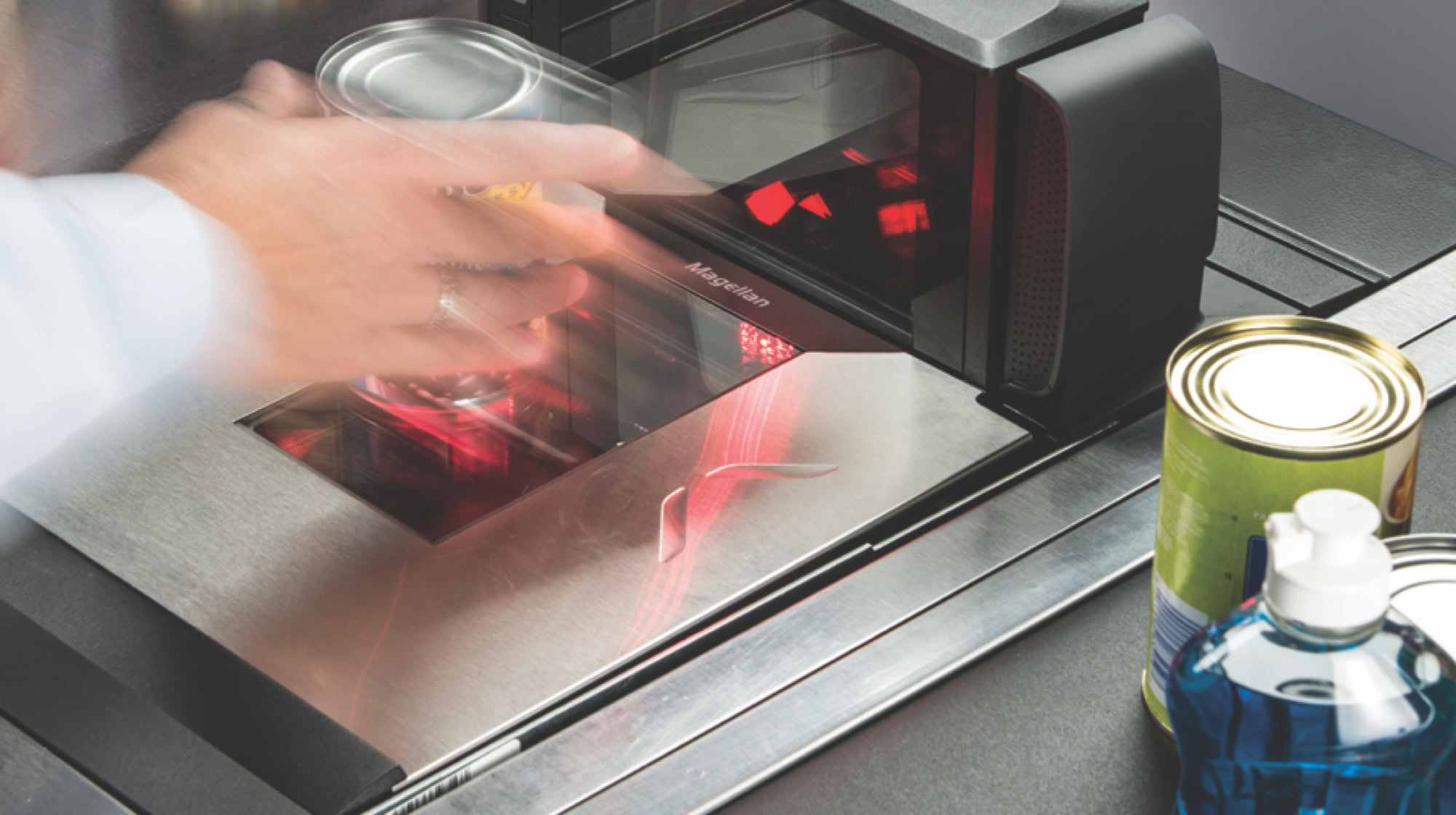 Grocery goods being scanned at a point of service terminal.