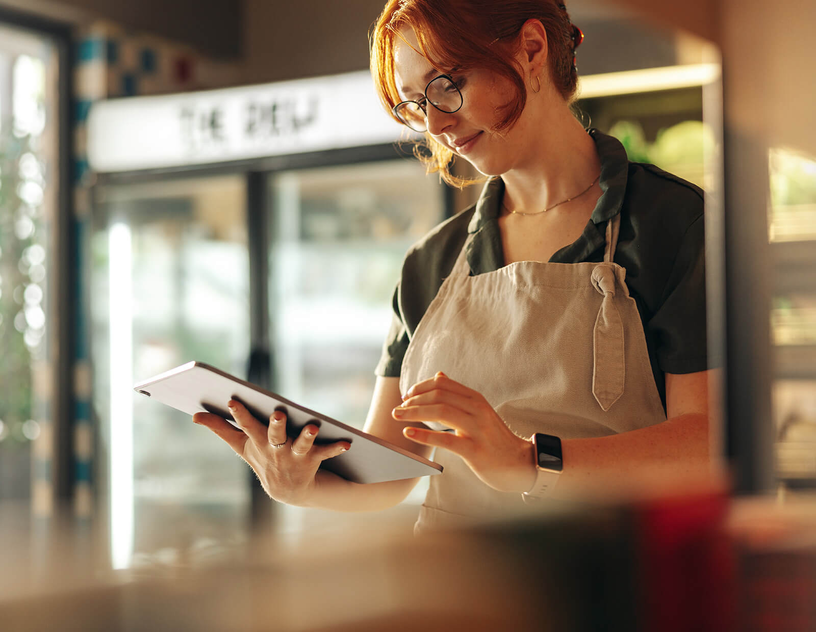 Cafe owner keeps tabs on her assets and consumables on her tablet.