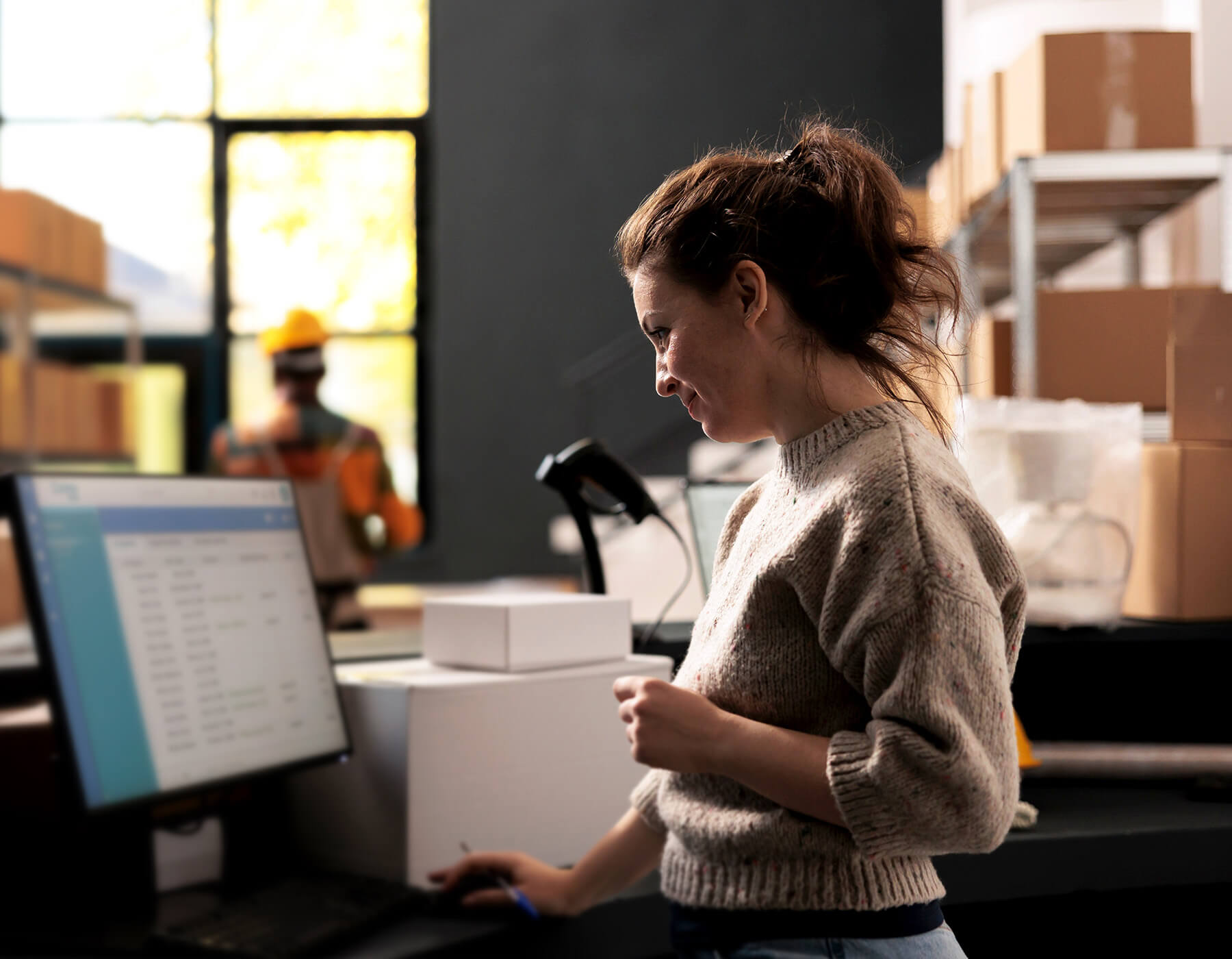 Woman smiles while using IntelliTrack to keep full visibility of her stock and assets.