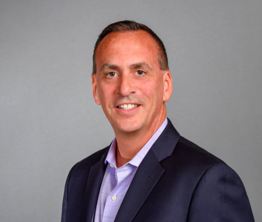 Brian Bukowski smiles at the camera.