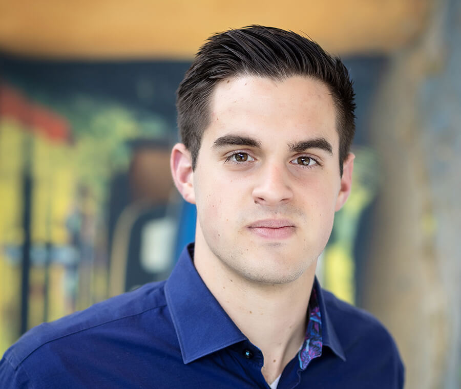 Luke Vargo smiles at the camera.