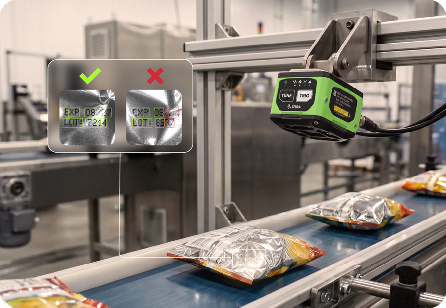 Zebra fixed industrial scanner inspecting packages on a manufacturing conveyor line